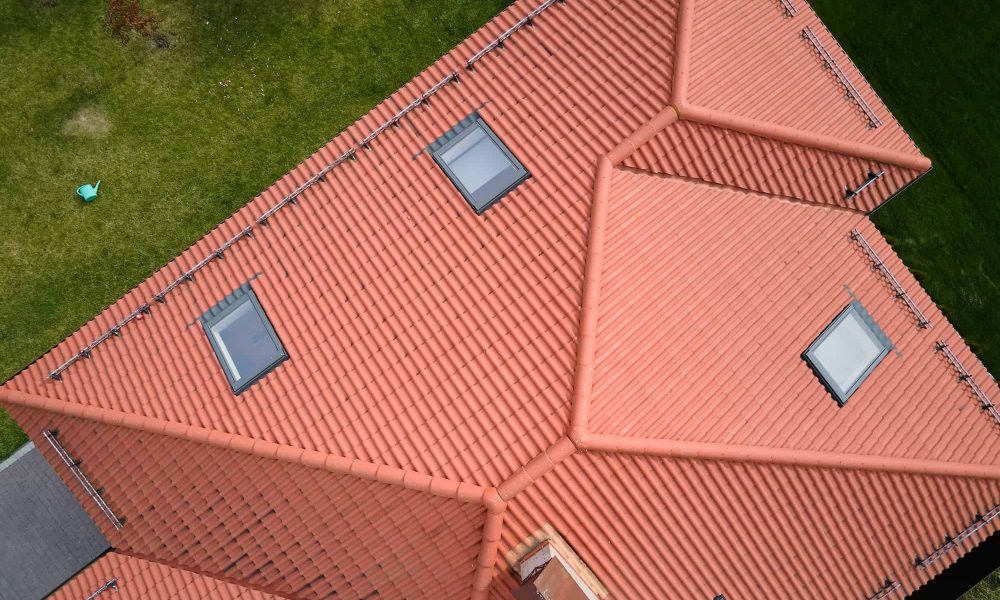 closeup-of-attic-windows-on-house-roof-top-covered-with-ceramic-shingles-tiled-covering-of-building.jpg